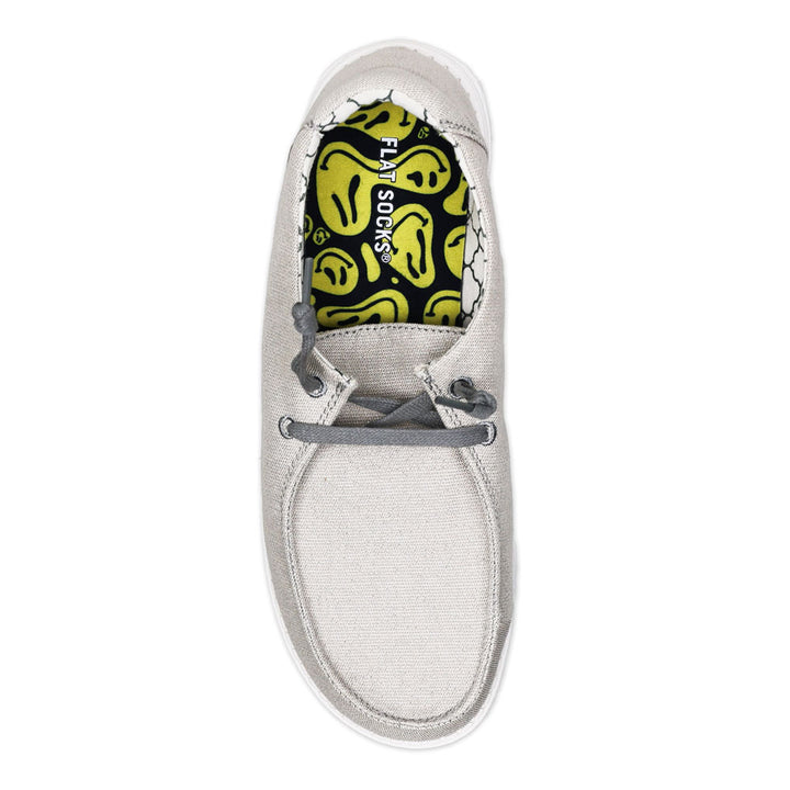 Black with yellow faces print FLAT SOCK in light gray slip-on shoe. Insole liner features black with wavy yellow smiley faces print on top fabric. Shoe liner is made of 100% polyester woven material, closest material to a traditional sock, helps protect and extend life of shoes. #size_small-up-to-women-s-11-men-s-10