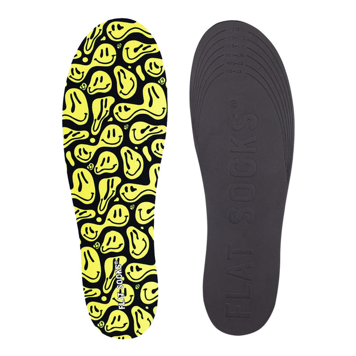 View of top fabric on left liner, view of bottom of right liner. Insole liner features black with yellow faces print on top fabric. Bottom of FLAT SOCK is 100% black polyurethane foam and provides slight cushion under foot and its super grippy surface helps liner stay in place all day #size_large-up-to-women-s-13-men-s-14