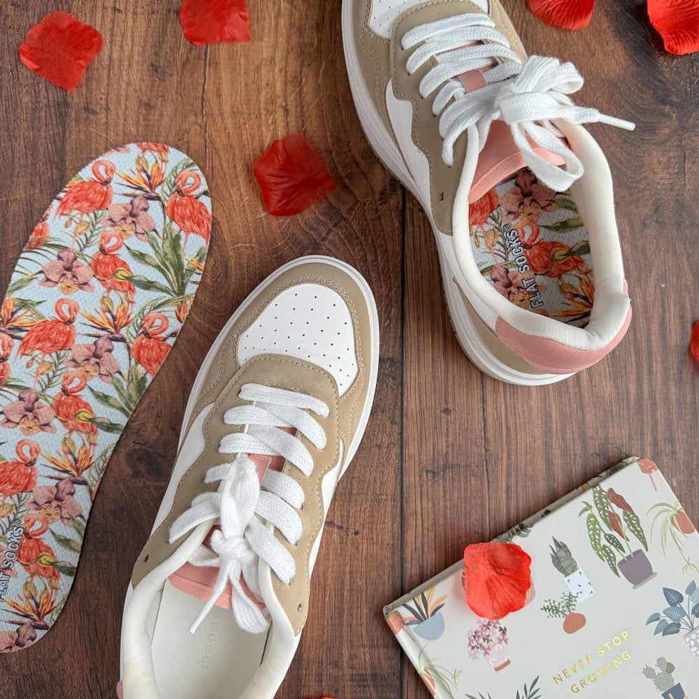 Flamazing FLAT SOCKS inside white and tan sneaker, sitting on wooden table #size_large-up-to-women-s-13-men-s-14