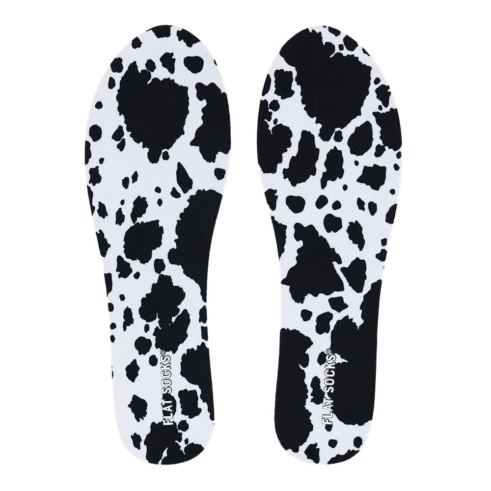 View of top fabric on pair of white and black animal print FLAT SOCK, insole liner features white and black cow print on top fabric #size_small-up-to-women-s-11-men-s-10