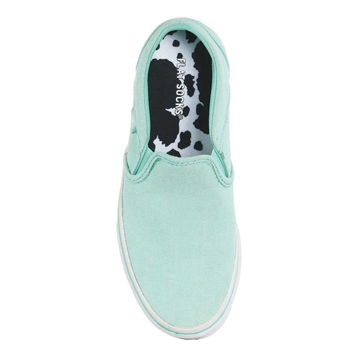 White and black animal print FLAT SOCK in turquoise slip-on shoe. Insole liner features white and black cow print on top fabric. Shoe liner is made of 100% polyester woven material, closest material to a traditional sock, helps protect and extend life of shoes. #size_small-up-to-women-s-11-men-s-10