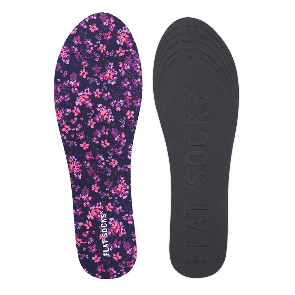 View of top fabric on left liner, view of bottom of right liner. Insole liner features dark purple with flowers print on top fabric. Bottom of FLAT SOCK is 100% black polyurethane foam and provides slight cushion under foot and its super grippy surface helps liner stay in place all day #size_small-up-to-women-s-11-men-s-10