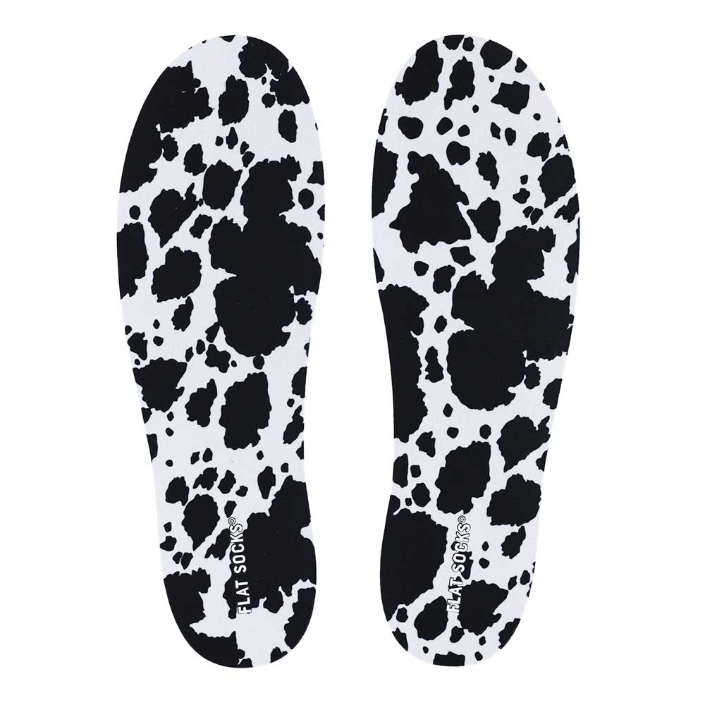 View of top fabric on pair of white and black animal print FLAT SOCK, insole liner features white and black cow print on top fabric #size_large-up-to-women-s-13-men-s-14
