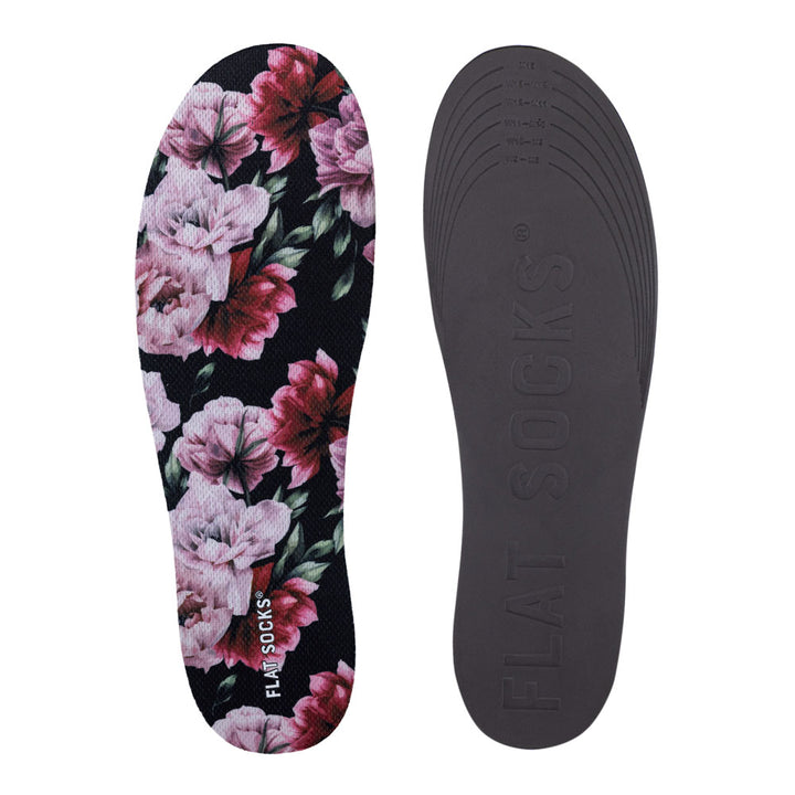 View of top fabric on left liner, view of bottom of right liner. Insole liner Features pink and dark fuchsia peony flowers and green peony leaves on top fabric. Bottom of FLAT SOCK is 100% black polyurethane foam and provides slight cushion under foot and its super grippy surface helps liner stay in place all day #size_large-up-to-women-s-13-men-s-14