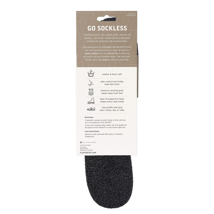 View of the back of black sherpa-like faux fur FLAT SOCK in packaging, washer & dryer safe, odor control tech help keep feet fresh, moisture-wicking pulls sweat away from foot, layer of supportive foam makes every step comfy, slim profile with grip won’t show, slip, or slide. #size_large-up-to-women-s-13-men-s-14