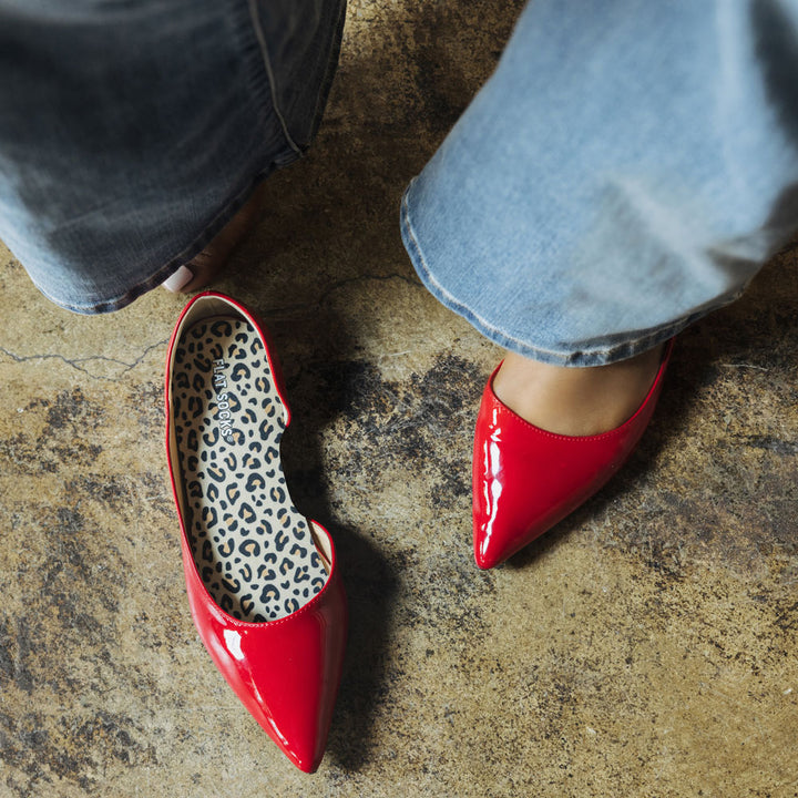 Woman wearing red faux leather flats with Leopard FLAT SOCKS inside #size_small-up-to-women-s-11-men-s-10